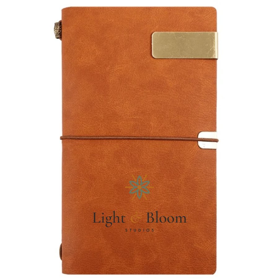 Leather-look notepad personalised with the Light & Bloom logo